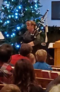 Solo piper at Christmas service